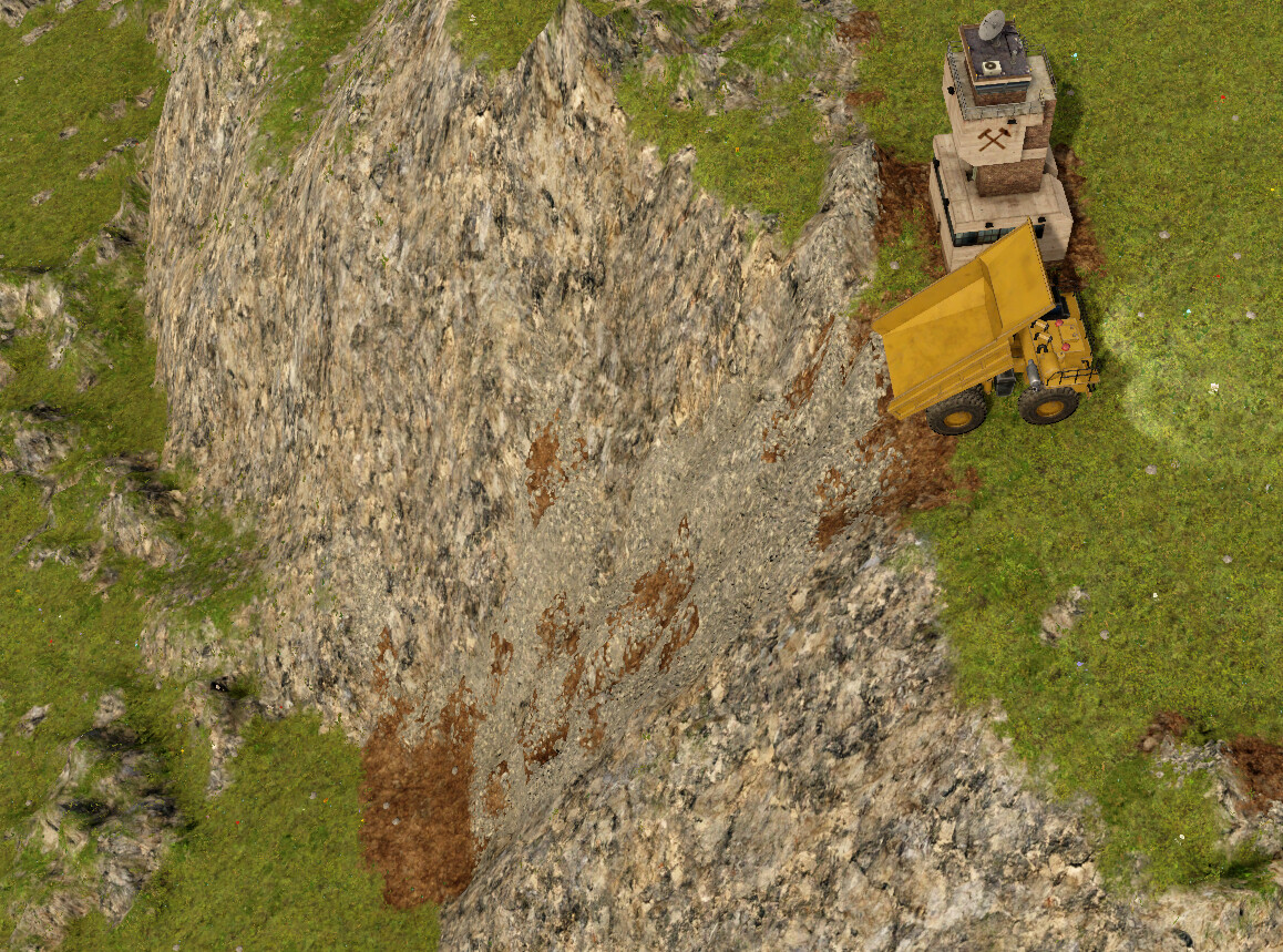 A trail of disrupted rock left on a mountain side caused by dirt falling over it.
